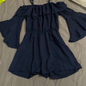 Navy blue romper with flared sleeves and of shoulder
